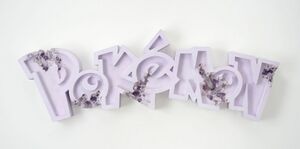 Daniel Arsham Pokémon Amethyst Crystalized Pokémon Logo.jpg